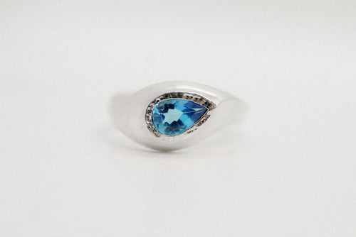 Sterling silver Flow Ring with pear-shaped Swiss blue topaz in a sculptural form.