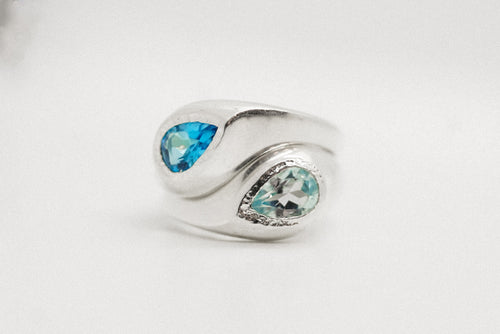 Sterling silver Flow Ring with pear-shaped Swiss blue topaz in a sculptural form.